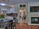 Well-equipped kitchen featuring modern appliances, white cabinets, granite countertops, and an adjacent dining area at 183 Eagles Club Dr, Stockbridge, GA 30281