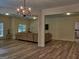 Spacious living area with hardwood flooring, chandelier, and a comfortable sofa at 183 Eagles Club Dr, Stockbridge, GA 30281