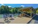 A covered grilling and seating area is near the tennis courts, perfect for parties and gathering at 3626 Lone Indian Trl, Marietta, GA 30066