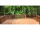 Spacious deck surrounded by trees provides an outdoor living space that's perfect for entertaining and relaxation at 3626 Lone Indian Trl, Marietta, GA 30066