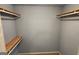 Walk-in closet with wooden shelves, light gray walls, and light-colored carpet at 3626 Lone Indian Trl, Marietta, GA 30066