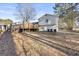The backyard view features a deck, the house exterior, and some tree coverage at 916 Marshall Fuller Rd, Dallas, GA 30157