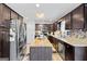 Well-equipped kitchen with stainless steel appliances, solid countertops, a kitchen island, and ample cabinet space at 916 Marshall Fuller Rd, Dallas, GA 30157