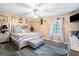 Cozy main bedroom with neutral walls, carpet floor, a large window, and lots of natural light at 916 Marshall Fuller Rd, Dallas, GA 30157