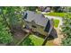 Back of house aerial view features a deck, fenced yard, and neighborhood at 1048 Falls Brooke Dr, Conyers, GA 30094