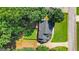 Aerial view showcases the roofline, private backyard, and neighborhood streets at 1048 Falls Brooke Dr, Conyers, GA 30094