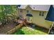 Aerial view of backyard features deck, fenced yard, and beige siding at 1048 Falls Brooke Dr, Conyers, GA 30094