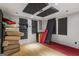 Basement room with hardwood floors, soundproofing panels, and a cozy area rug at 1048 Falls Brooke Dr, Conyers, GA 30094