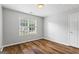 Comfortable bedroom with modern flooring, natural light, and a large closet at 1048 Falls Brooke Dr, Conyers, GA 30094