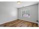 Comfortable bedroom with a large window for natural light and modern flooring at 1048 Falls Brooke Dr, Conyers, GA 30094