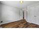 Bedroom featuring updated flooring, a double closet, and neutral wall paint at 1048 Falls Brooke Dr, Conyers, GA 30094