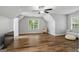 Bright bedroom features updated floors, chair rail, and modern ceiling fan at 1048 Falls Brooke Dr, Conyers, GA 30094