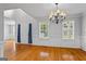 Elegant dining area features hardwood floors and ample natural light, perfect for formal occasions at 1048 Falls Brooke Dr, Conyers, GA 30094