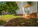 Home exterior with double doors leading to the backyard from the lower level at 1048 Falls Brooke Dr, Conyers, GA 30094
