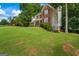 Charming two-story home with brick and siding, complemented by a lush green lawn at 1048 Falls Brooke Dr, Conyers, GA 30094