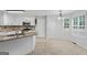 Eat-in kitchen features updated appliances, granite countertops, white cabinetry and lots of natural light at 1048 Falls Brooke Dr, Conyers, GA 30094