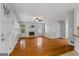 Bright open living room boasts hardwood floors, a cozy fireplace, and multiple windows at 1048 Falls Brooke Dr, Conyers, GA 30094