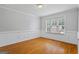 Cozy living room features beautiful hardwood floors and neutral paint, creating a warm atmosphere at 1048 Falls Brooke Dr, Conyers, GA 30094