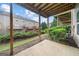Backyard patio space with lush greenery and views of the surrounding neighborhood at 10775 Brunson Dr, Johns Creek, GA 30097