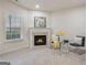 Inviting fireplace with a decorative mantel, creating a warm and charming ambiance at 10775 Brunson Dr, Johns Creek, GA 30097