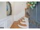 Bright entry foyer with hardwood floors and paneled walls at 10775 Brunson Dr, Johns Creek, GA 30097