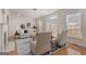 Inviting living room with lots of natural light, neutral furniture, and a view of the neighborhood at 10775 Brunson Dr, Johns Creek, GA 30097