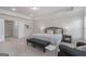 Bright, spacious main bedroom with tray ceiling, and door to walk-in closet at 10775 Brunson Dr, Johns Creek, GA 30097