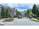 Gated community entrance with manicured landscaping and sidewalks at 4107 Township Pkwy # 69, Sandy Springs, GA 30342