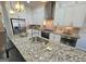 Granite countertops and stainless steel appliances outfit this modern, sunlit kitchen at 4107 Township Pkwy # 69, Sandy Springs, GA 30342
