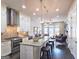 Bright, modern kitchen with granite countertops, stainless steel appliances, an island with seating, and an open layout at 4107 Township Pkwy # 69, Sandy Springs, GA 30342