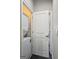 Efficient laundry room with a stacked washer and dryer and a conveniently located door for easy access at 4107 Township Pkwy # 69, Sandy Springs, GA 30342