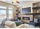 Cozy living room with a brick fireplace, built-in shelving, and lots of seating at 4107 Township Pkwy # 69, Sandy Springs, GA 30342