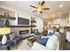 Cozy living room featuring a brick fireplace, built-in shelves, comfortable seating, and an open view to the kitchen at 4107 Township Pkwy # 69, Sandy Springs, GA 30342