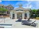 Poolside community cabana with shaded seating and lounge chairs at 4107 Township Pkwy # 69, Sandy Springs, GA 30342