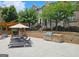 Community pool with lounge chairs, grill and sun umbrellas at 4107 Township Pkwy # 69, Sandy Springs, GA 30342