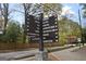 Community sign with wayfinding to the amphitheater, horse park, playground, and pool at 4107 Township Pkwy # 69, Sandy Springs, GA 30342
