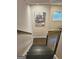 Staircase featuring a decorative art piece above the landing, a window for natural light, and a wooden railing at 4107 Township Pkwy # 69, Sandy Springs, GA 30342