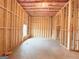 Unfinished basement featuring wood framing, ceiling insulation, with defined room layouts and a window at 5342 Legacy Trl # 30, Douglasville, GA 30135