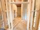 View of the unfinished basement featuring wood framing and a blank canvas to make your own at 5342 Legacy Trl # 30, Douglasville, GA 30135