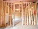 Unfinished basement with wood framing, insulation, and clearly defined room layouts at 5342 Legacy Trl # 30, Douglasville, GA 30135