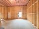Spacious unfinished basement with a window and door, ready for personalized finishing touches at 5342 Legacy Trl # 30, Douglasville, GA 30135