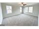 Spacious bedroom with neutral carpeting and multiple windows providing natural light at 5342 Legacy Trl # 30, Douglasville, GA 30135