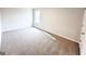 Bright bedroom featuring neutral walls, plush carpeting and a window for natural light at 5342 Legacy Trl # 30, Douglasville, GA 30135