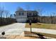 Charming two-story home with a front-facing garage, landscaped yard and covered porch at 5342 Legacy Trl # 30, Douglasville, GA 30135