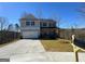 Charming two-story home with a front-facing garage, landscaped yard and covered porch at 5342 Legacy Trl # 30, Douglasville, GA 30135