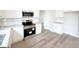 Close up of the kitchen featuring stainless steel appliances, granite countertops and white cabinetry at 5342 Legacy Trl # 30, Douglasville, GA 30135
