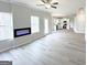 Living room featuring an electric fireplace and kitchen at 5342 Legacy Trl # 30, Douglasville, GA 30135
