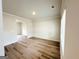 Bright and airy living room with light wood floors, perfect for entertaining and relaxing at 5342 Legacy Trl # 30, Douglasville, GA 30135