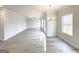 Open-concept living space with dining area and luxury vinyl flooring at 5342 Legacy Trl # 30, Douglasville, GA 30135
