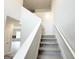 Bright staircase with carpeted steps leads to the upper level of the home at 5342 Legacy Trl # 30, Douglasville, GA 30135